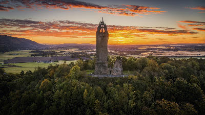 The Wallace Monument tower on Abbey Craig overlooking the landscape near Stirling in Central Scotland.