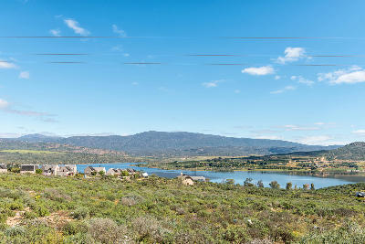 Homes overlooking Clanwilliam Dam with views of the surrounding Cederberg foothills in South Africa.