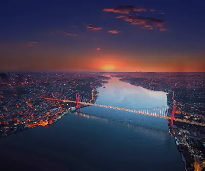 Aerial view of the Bosphorus at dusk with the 15 July Martyrs Bridge connecting the European and Asian sides of Istanbul.