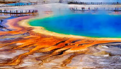 Grand Prismatic Spring Yellowstone National Park colorful geothermal hot spring with boardwalk and tourists