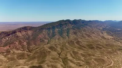 Aerial view of rugged mountain ridges and dry valleys in the Flinders Ranges, South Australia.