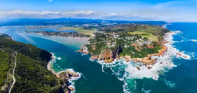 Aerial view of Knysna Heads showing the rocky headlands, ocean entrance and expansive Knysna Lagoon beyond on South Africa’s Garden Route.