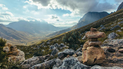 Rock cairn overlooking the mountain landscape of Jonkershoek Valley in Jonkershoek Nature Reserve near Stellenbosch, Cape Winelands, Western Cape, South Africa.