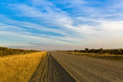 Highland Lakes Road through golden grassland near Great Lake in Tasmania’s Central Plateau.