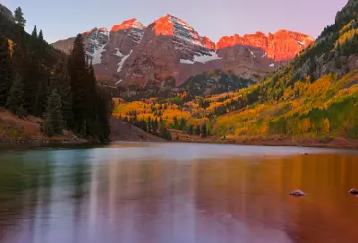 Maroon Bells sunrise alpenglow Maroon Lake autumn Aspen Colorado