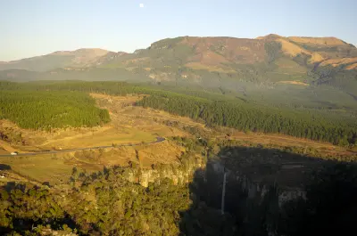 Aerial landscape showing Mac Mac Falls, pine plantations, winding roads and the escarpment mountains of the Panorama Route in Mpumalanga, South Africa.