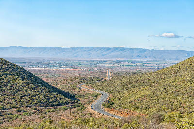 Winding road descending into the Klein Karoo landscape near Calitzdorp in the Western Cape, South Africa.