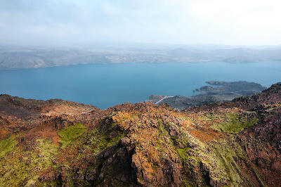 Elevated view of Kleifarvatn lake with blue water bordered by rugged volcanic terrain on the Reykjanes Peninsula, Iceland.