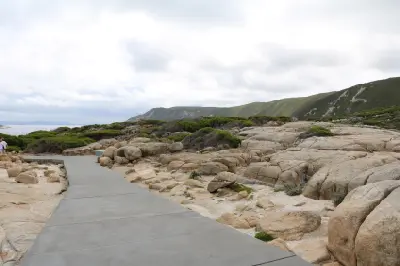 Paved walking path through granite outcrops near Natural Bridge and The Gap in Torndirrup National Park, Western Australia.