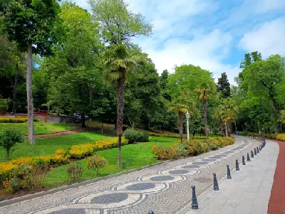 Tree-lined walking path and landscaped gardens in Yıldız Park, Beşiktaş, Istanbul.