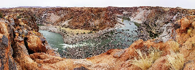 Panoramic view of the Orange River winding through the granite walls of the Orange River Gorge from Ararat Viewpoint in Augrabies Falls National Park.