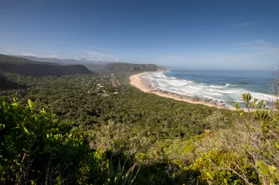 Panoramic view of Nature's Valley beach, coastal forest and Indian Ocean on the Garden Route in South Africa.