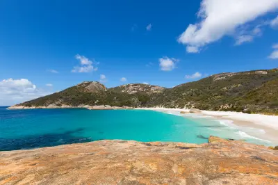 Elevated view over turquoise water, white sand and Mount Gardner at Little Beach near Albany, Western Australia.