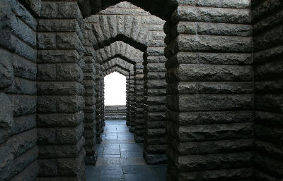 Granite archways and stone passage beneath the Voortrekker Monument in Pretoria.