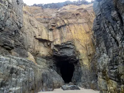 Rock entrance and layered cliffs of Remarkable Cave on the Tasman Peninsula, Tasmania.