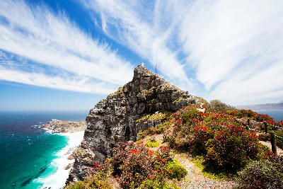Cliffs of Cape Point with the historic lighthouse above the Atlantic Ocean on the Cape Peninsula in Table Mountain National Park, South Africa.