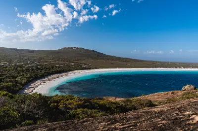 Elevated view over the white sand, turquoise water and granite landscape of Hellfire Bay in Cape Le Grand National Park, Western Australia.