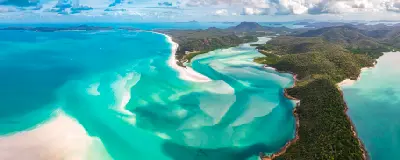 Aerial panorama of Hill Inlet, Whitehaven Beach and forested Whitsunday Island in Queensland, Australia.