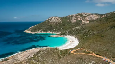 Aerial view of Little Beach, turquoise water, white sand, granite hills and beach access at Two Peoples Bay near Albany, Western Australia.