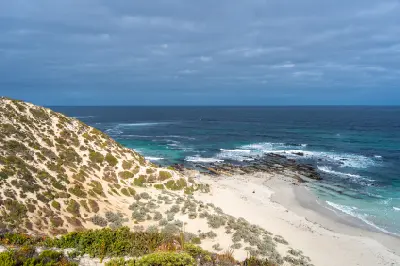 Sandy coastal dunes, rocky shoreline and turquoise ocean at Seal Bay Conservation Park, Kangaroo Island, South Australia.