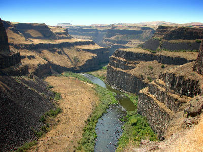 Layered cliffs and the winding Palouse River carve through the canyon system downstream of Palouse Falls.