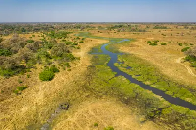 Aerial view of the winding Khwai River and surrounding floodplains on the northern boundary of Moremi Game Reserve in Botswana.