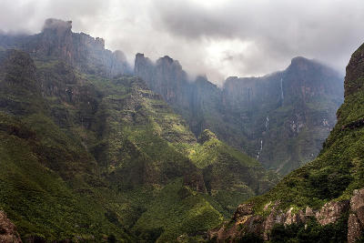 Tugela Falls descending the Amphitheatre escarpment beneath mist and cloud in Royal Natal National Park, Drakensberg, South Africa.