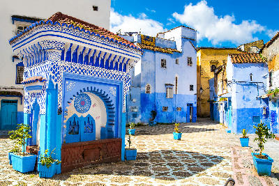 Blue-painted square and traditional Moroccan architecture in the medina of Chefchaouen, Morocco