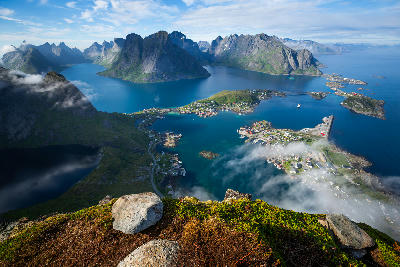 Panoramic view from Reinebringen summit over Reine harbour and fjords in the Lofoten Islands, Norway.