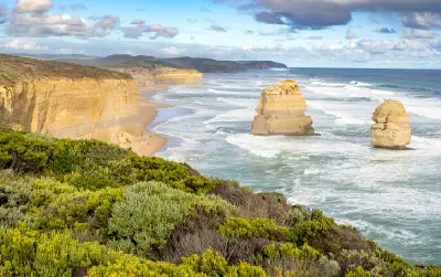 Elevated view of Gog and Magog limestone sea stacks, cliffs and Gibson Steps Beach in Victoria, Australia.