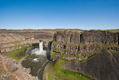 Palouse Falls dropping into a basalt canyon in southeastern Washington State under clear blue skies