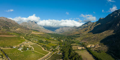 Panoramic view of vineyards and farmland in Jonkershoek Valley near Stellenbosch in the Cape Winelands, Western Cape, South Africa.