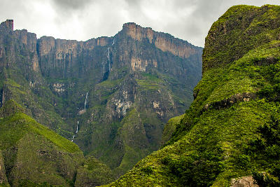 Tugela Falls flowing from the Amphitheatre escarpment in Royal Natal National Park, Drakensberg, South Africa, under dramatic cloud cover.