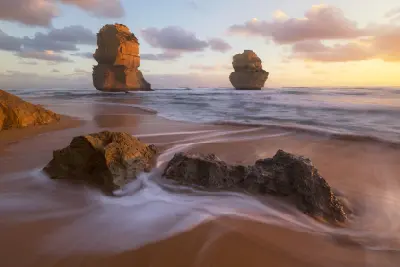 Limestone sea stacks and waves at sunset from Gibson Steps Beach, Port Campbell National Park, Victoria, Australia.