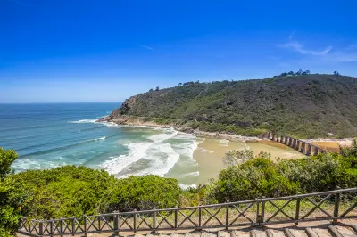 View of the Kaaimans River mouth near Wilderness showing the railway bridge, rocky headland and Indian Ocean coastline on the Garden Route.