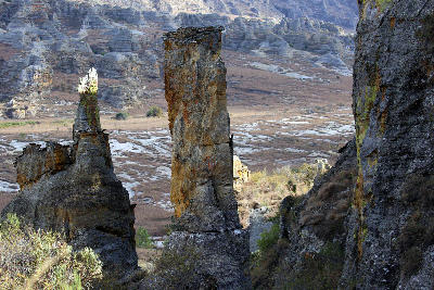 Towering sandstone rock pillars rising above the eroded plateau landscapes of Isalo National Park, Madagascar