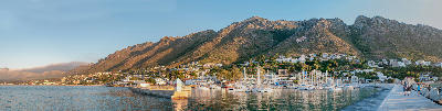 Gordon's Bay Harbour and marina at sunset with the Hottentots-Holland Mountains in the background, Western Cape, South Africa.