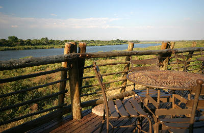 Outdoor tables and chairs on the Lower Sabie viewing deck above the Sabie River in Kruger National Park.