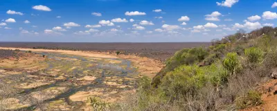 Elevated view of the Letaba River winding through a wide rocky riverbed below Letaba Rest Camp in Kruger National Park.