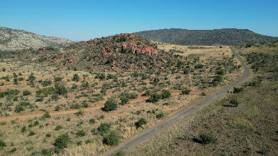 Volcanic hill and open bushveld landscape in Pilanesberg National Park, North West Province, South Africa.