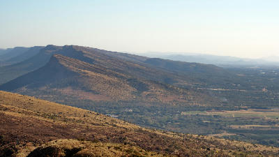Panoramic view of the Magaliesberg mountain range overlooking the Hartbeespoort valley in North West Province, South Africa.
