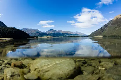 Clear water and mountain reflections at Diamond Lake near Glenorchy, Otago, South Island, New Zealand.
