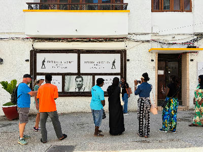 Visitors gathered outside the Freddie Mercury Museum in Stone Town, Zanzibar, viewing displays at the musician's birthplace.