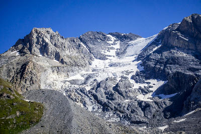 The north-facing glacier of Grande Casse descends in layered ice fields beneath steep rock walls above Pralognan-la-Vanoise.