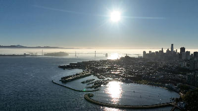 Aerial sunrise view of San Francisco Bay with skyline, Golden Gate Bridge and Bay Bridge in California