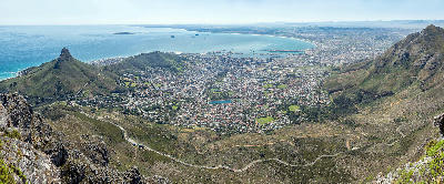 Panoramic view of Cape Town City Bowl from Table Mountain with Lion’s Head and coastline.