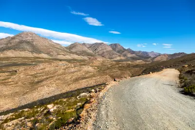 Gravel road crossing the Swartberg Mountains on the route to Gamkaskloof in the Klein Karoo, South Africa.