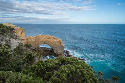Elevated view of The Grotto limestone arch above the Southern Ocean in Victoria, Australia.