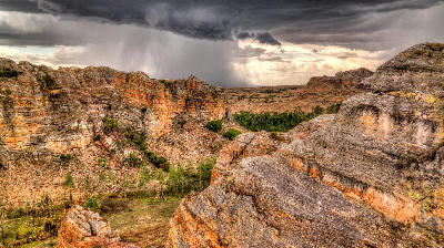 Storm clouds gathering above sandstone canyon landscapes in Isalo National Park, Madagascar