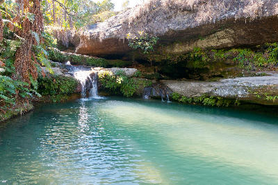 Turquoise natural pool and small waterfall inside Isalo National Park, Madagascar
